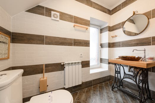Elegant bathroom featuring a rustic wood vanity and modern fixtures in natural light.